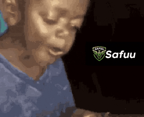 a close up of a child 's face with the words safuu written on the bottom .