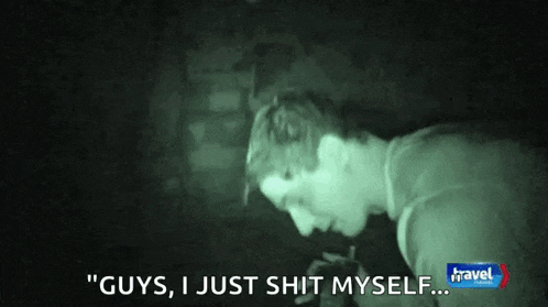 a man is smoking a cigarette in a dark room and says `` guys , i just shit myself '' .