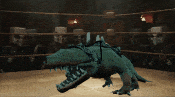 a crocodile is tied up in a boxing ring with skulls in the background