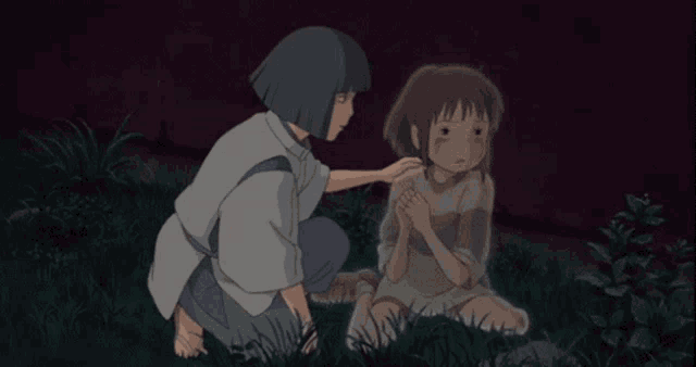 a boy and a girl are touching each other 's faces