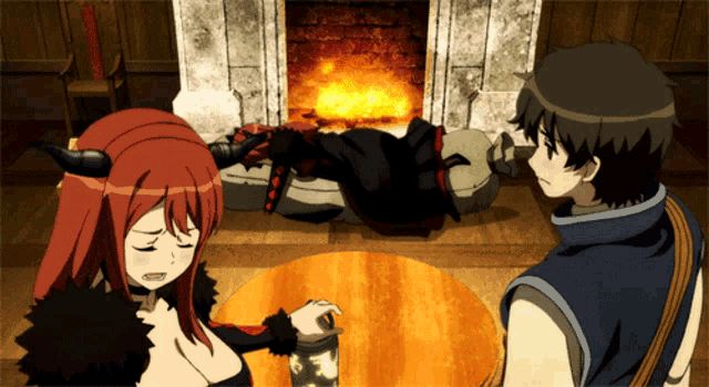 a man and a woman sit in front of a fireplace