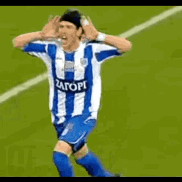 a man in a blue and white striped shirt with the number 18 on it