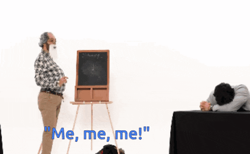 three men sit at a table with the words " me me me " written on the table cloth