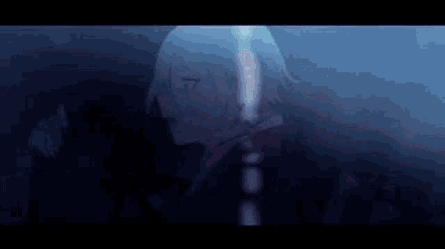 a close up of a person 's face in a dark room with a sword .