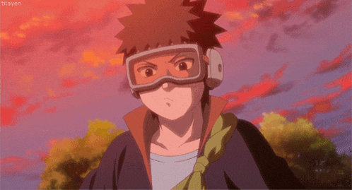 a young boy wearing goggles and headphones is standing in front of a red sky