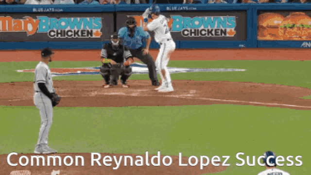 a baseball game is being played with advertisements for mary brown 's chicken