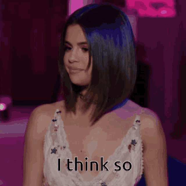 a woman in a white dress says i think so in a pixelated image