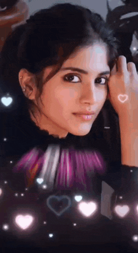 a close up of a woman 's face with hearts around it
