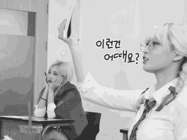 a black and white photo of two girls with foreign writing