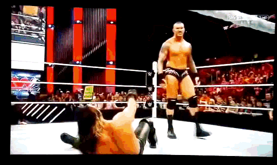 a man in a wrestling ring with a sign that says " do not enter " on it