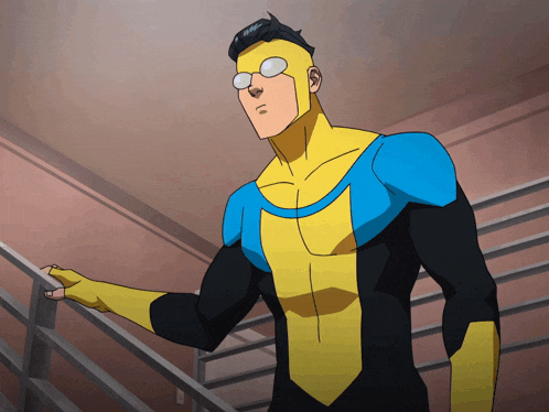 a man in a yellow and blue superhero costume