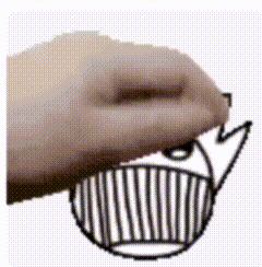 a close up of a person 's hand drawing a cartoon whale .