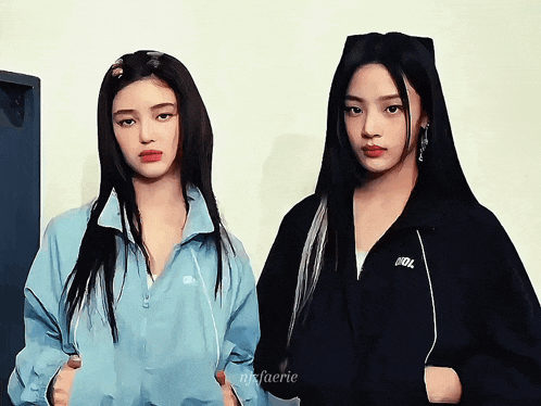 a couple of girls standing next to each other with one wearing a jacket that says idol on it