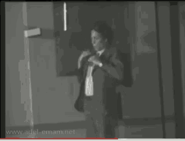 a black and white photo of a man with the website www.adel-emam.net in the upper right corner