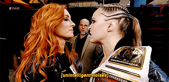 two women are facing each other and one of them is wearing a belt that says ' unintelligent noises '
