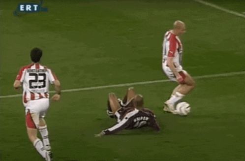 a soccer player with the number 40 on his back kicks the ball