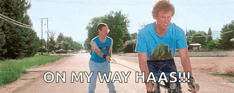 two men walking a dog on a leash with the words on my way haas written below them