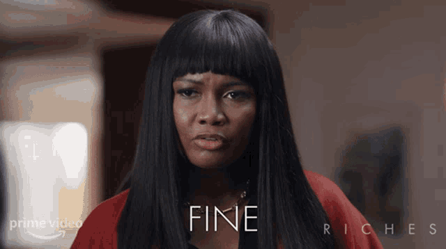 a woman in a red top is featured in a prime video ad for fine riches