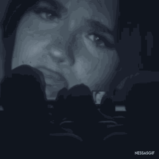 a black and white photo of a woman with the words nessasgif on the bottom