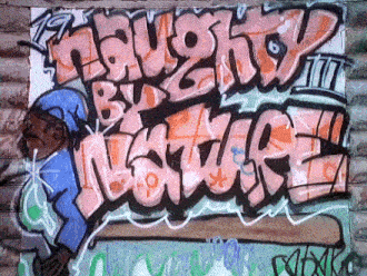 graffiti on a wall that says " laugh by nature "