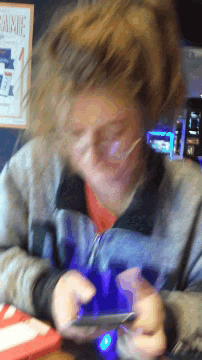 a blurred image of a person with a sign that says annie in the background