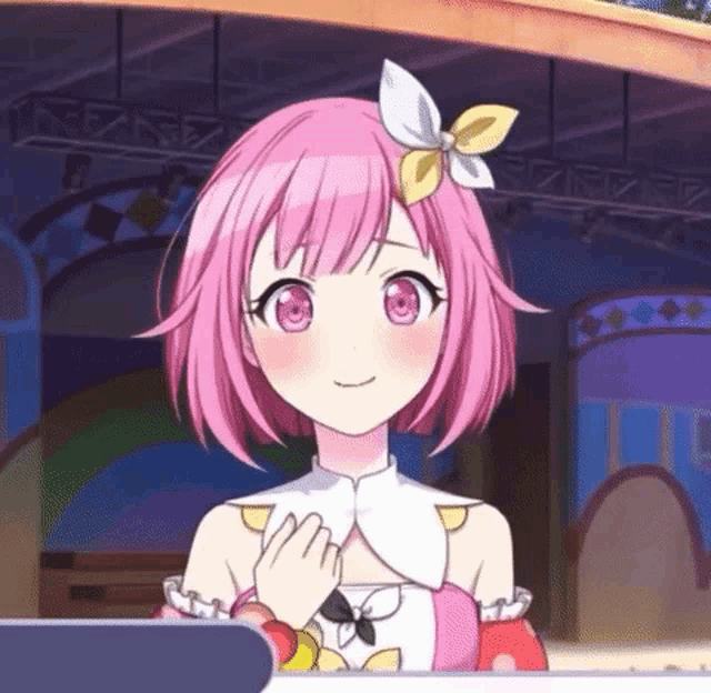 a cartoon girl with pink hair and a flower in her hair is holding her hand to her chest .