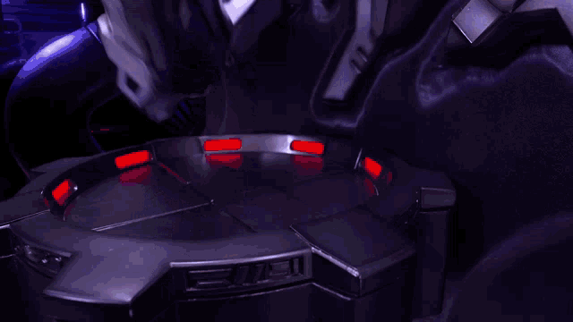 a statue of a robot with the letter a on it 's chest