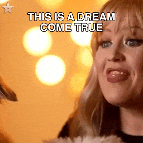 a woman says this is a dream come true with her tongue out