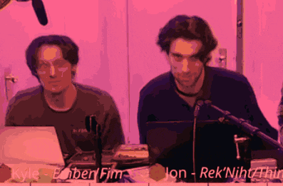 two men are sitting in front of a microphone and their names are kyle and ebnerfim