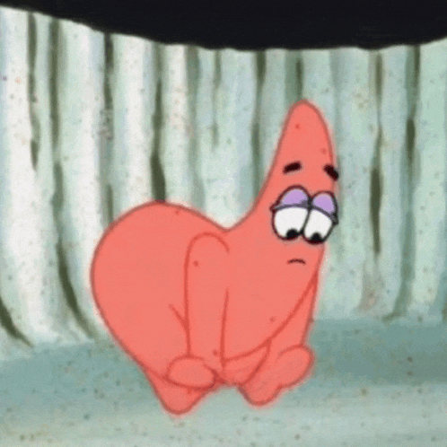 patrick star from spongebob squarepants is sitting on the ground with his eyes closed .