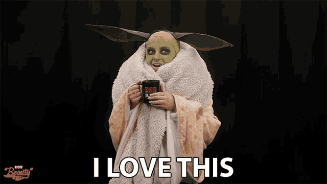 a person in a mask holding a mug that says i love this on it