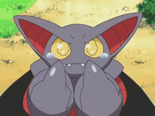 a cartoon cat with yellow eyes is covering its face with its hands .