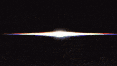 a black and white image of a light coming out of the middle