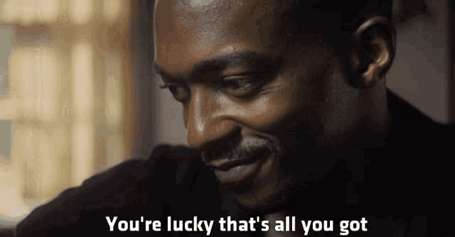 a man says " you 're lucky that 's all you got " while smiling