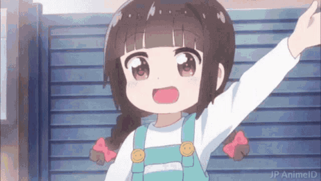 a little girl is standing in front of a fence with her arms outstretched ..