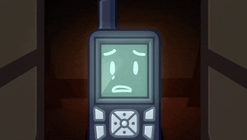 a cell phone with a sad face on its screen