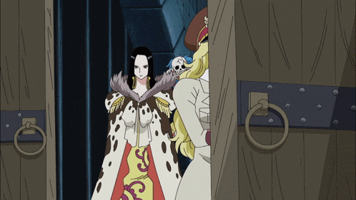 a woman with a skull on her head stands next to another woman in a white dress