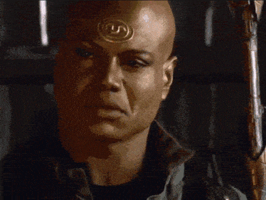 a bald man with a circle on his forehead says indeed