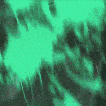 a green and black background with a glowing light coming out of it .