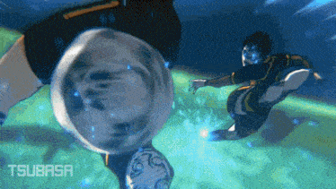 a soccer player kicks a ball in the water with tsubasa written on the bottom