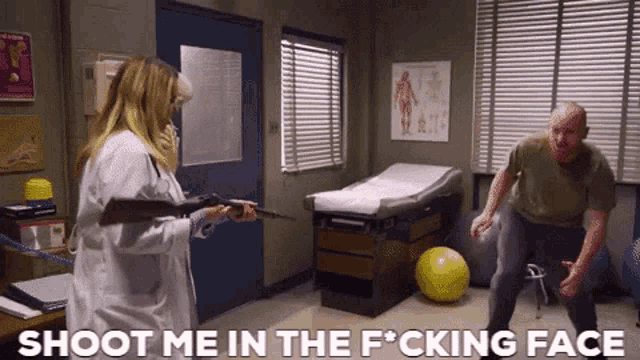 a woman is pointing a gun at a man with the words shoot me in the f * cking face written below her
