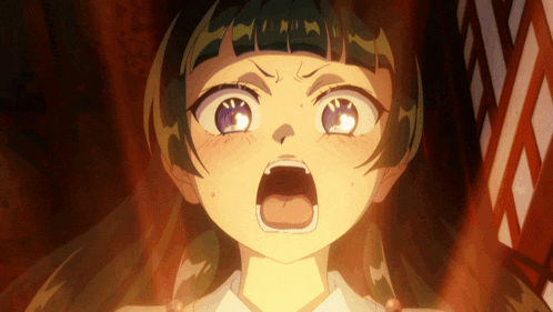 a close up of a girl 's face with her mouth wide open
