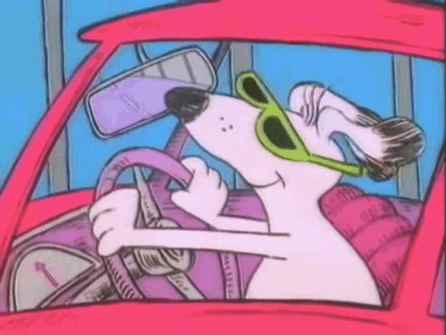 a dog wearing sunglasses is driving a pink car
