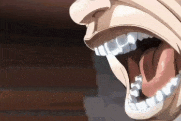 a close up of a person 's mouth with their mouth open and their tongue sticking out .