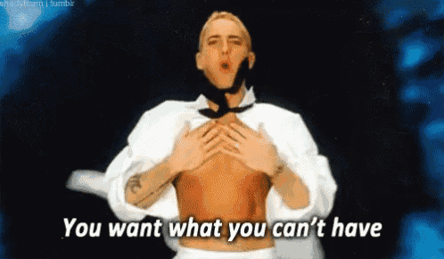 a man without a shirt is holding his chest and says you want what you can 't have