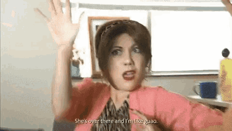 a woman in a pink shirt says she 's over there and i 'm like guao .