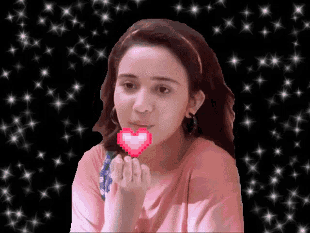 a woman blowing a kiss with a pixelated heart in her mouth