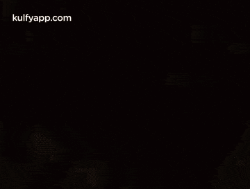a close up of a blurred image with the words kulfyapp.com at the bottom