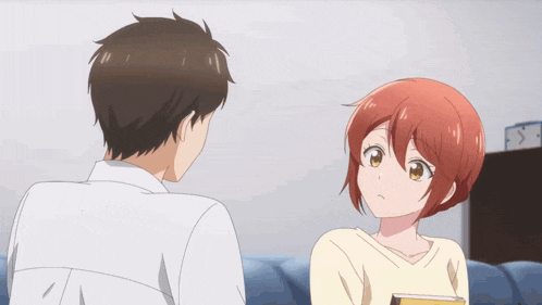 a girl with red hair and yellow eyes looks up at something