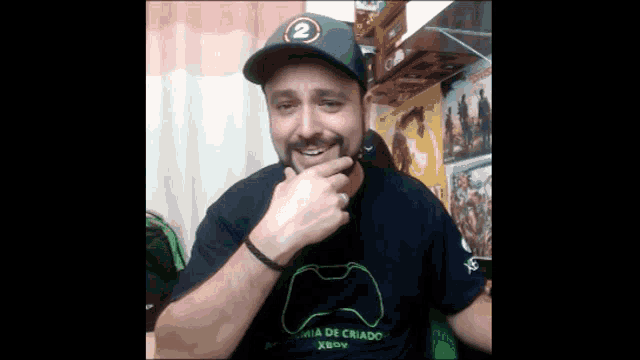 a man wearing a t-shirt that says xbox on it